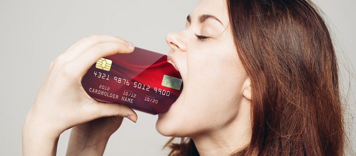 woman eating drinking credit card of plastic microplastic